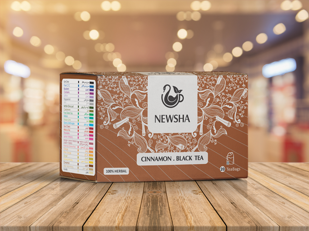Box of Newsha Cinnamon Black Tea with floral and cinnamon design on a brown background. Labeled "100% Herbal," contains 20 tea bags.
